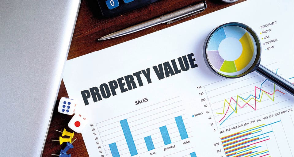 Working desk displaying a detailed property valuation report